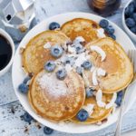 pancakes with fresh blueberries and honey for breakfast